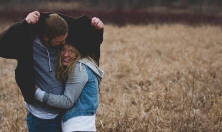 https://www.pexels.com/photo/man-and-woman-hugging-on-brown-field-853407/