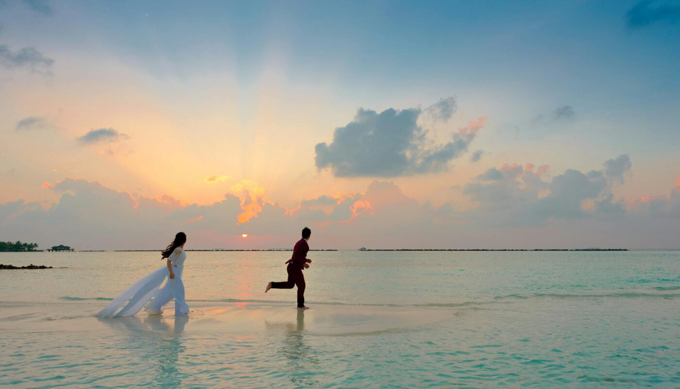 https://www.pexels.com/photo/man-and-woman-standing-at-seashore-1024969/