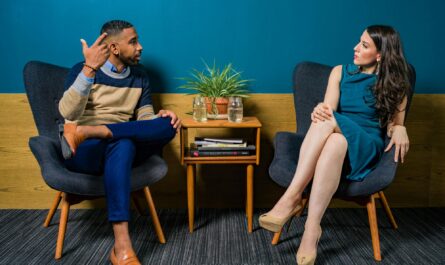 https://www.pexels.com/photo/woman-wearing-teal-dress-sitting-on-chair-talking-to-man-2422280/