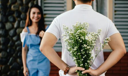 https://www.pexels.com/photo/man-holding-baby-s-breath-flower-in-front-of-woman-standing-near-marble-wall-935789/