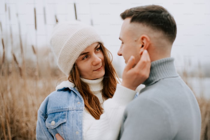 https://unsplash.com/photos/a-man-and-woman-standing-next-to-each-other-4AfUISRLpc8