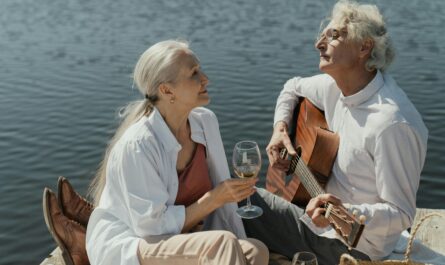 https://www.pexels.com/photo/man-and-woman-sitting-on-white-chair-playing-guitar-5934335/