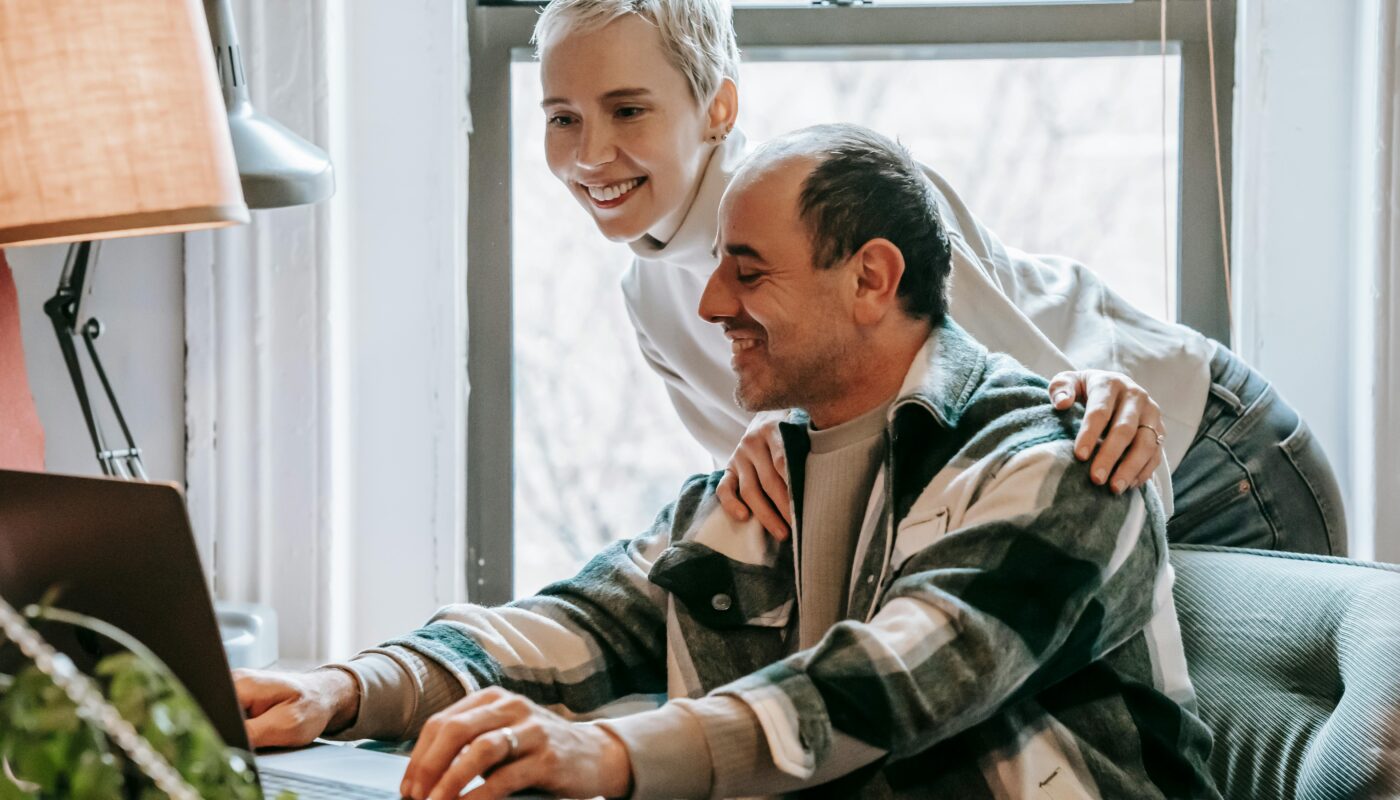 https://www.pexels.com/photo/cheerful-couple-working-together-with-laptop-6248751/