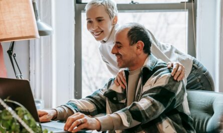 https://www.pexels.com/photo/cheerful-couple-working-together-with-laptop-6248751/