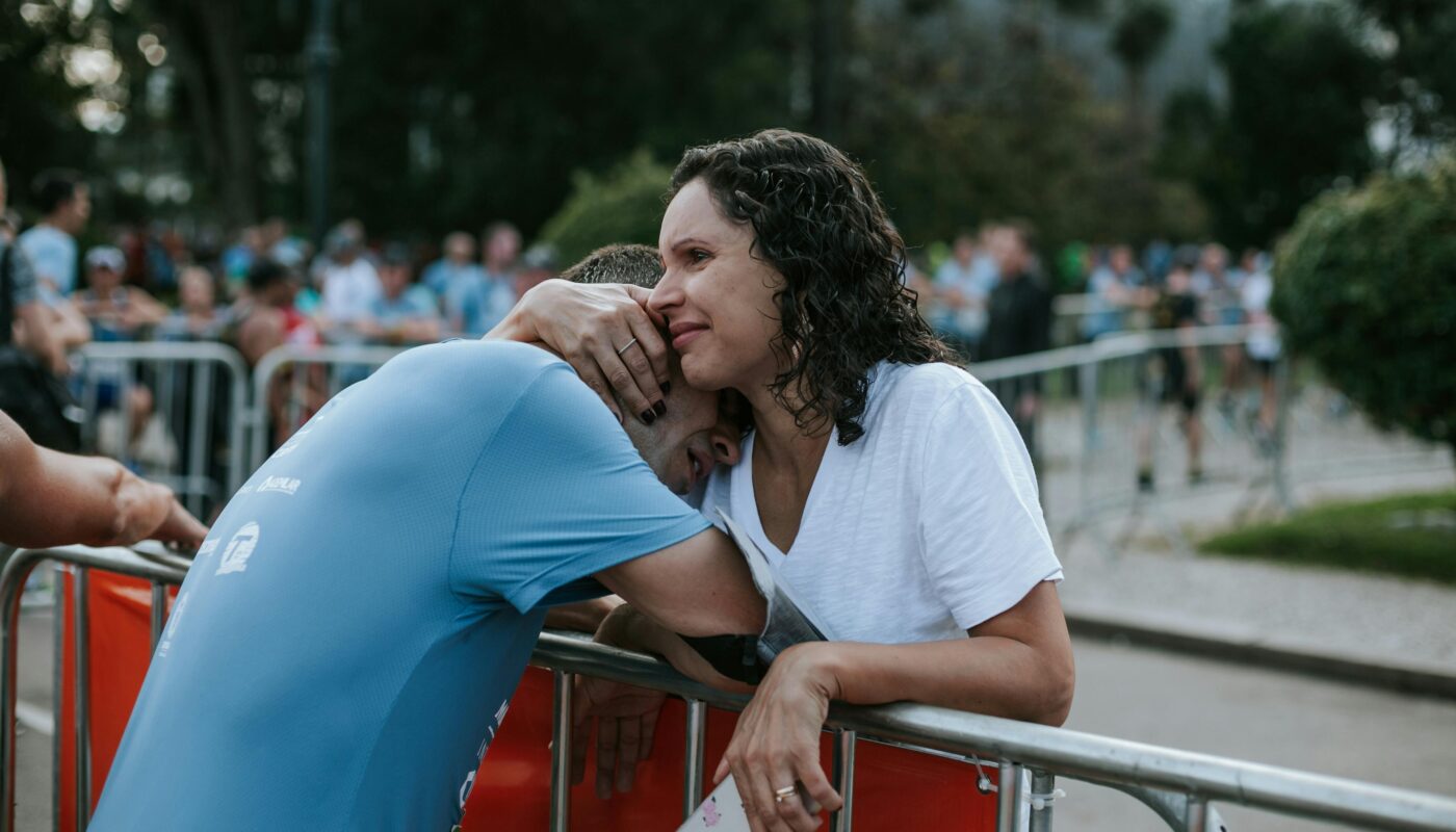 https://www.pexels.com/photo/woman-hugging-man-wearing-blue-crew-neck-shirt-2285463/