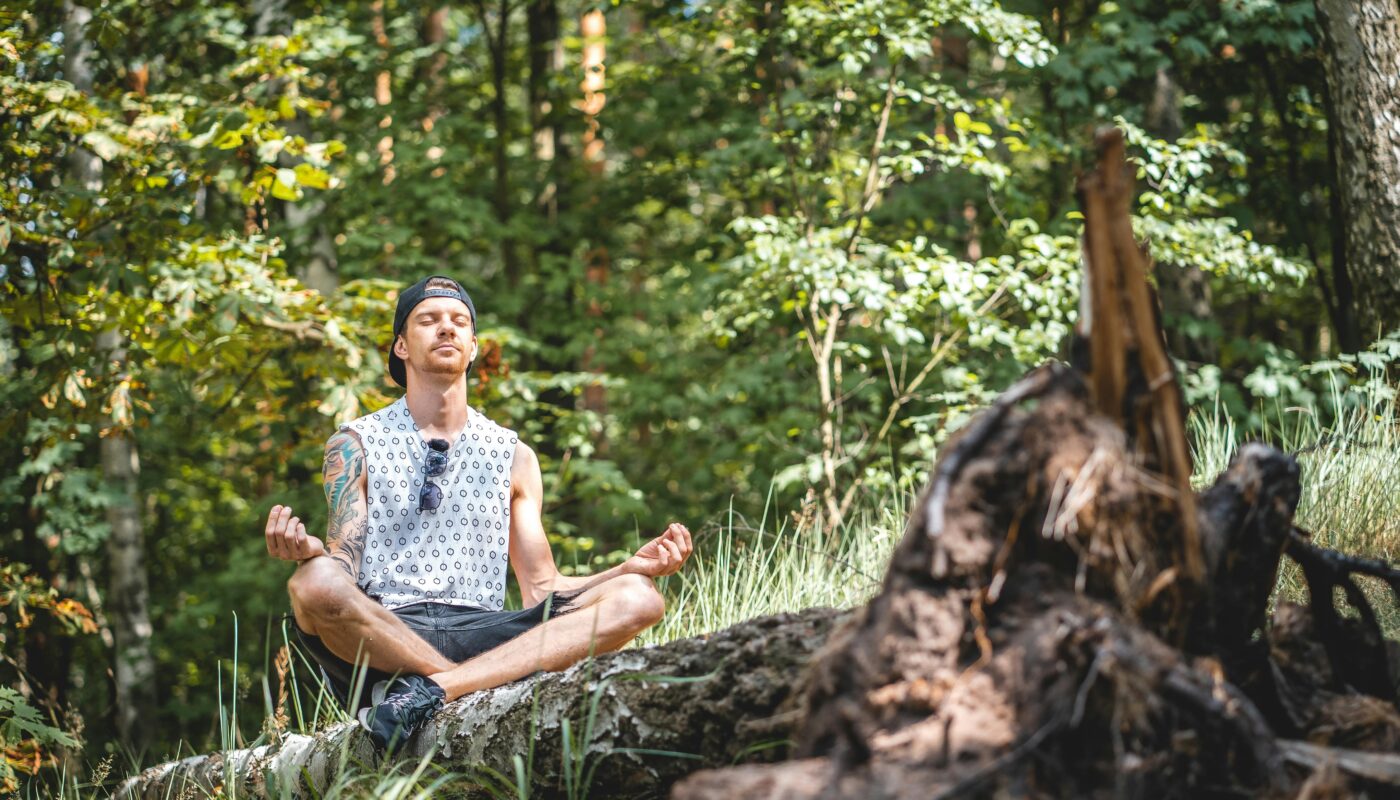 https://www.pexels.com/photo/man-meditating-on-a-tree-log-3576284/