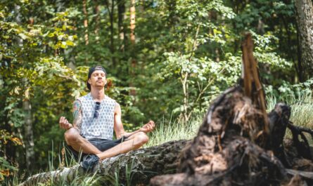 https://www.pexels.com/photo/man-meditating-on-a-tree-log-3576284/