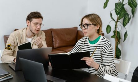 https://www.pexels.com/photo/man-and-woman-discussing-in-workplace-7550581/