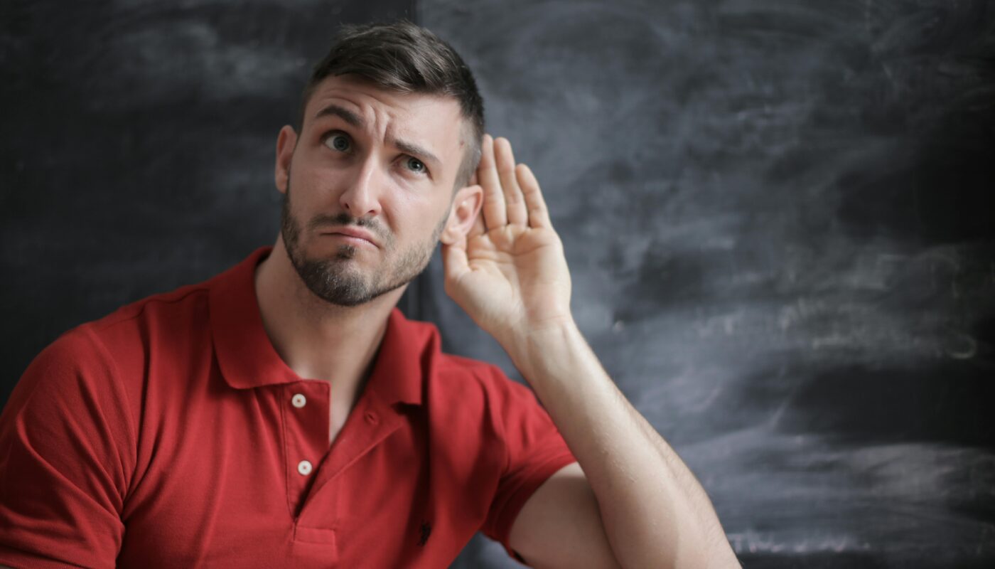 https://www.pexels.com/photo/man-in-red-polo-shirt-sitting-near-chalkboard-3779448/