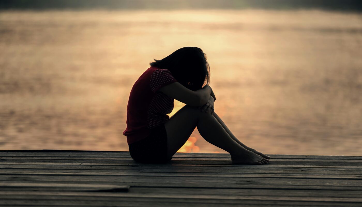 https://www.pexels.com/photo/woman-looking-at-sea-while-sitting-on-beach-247314/