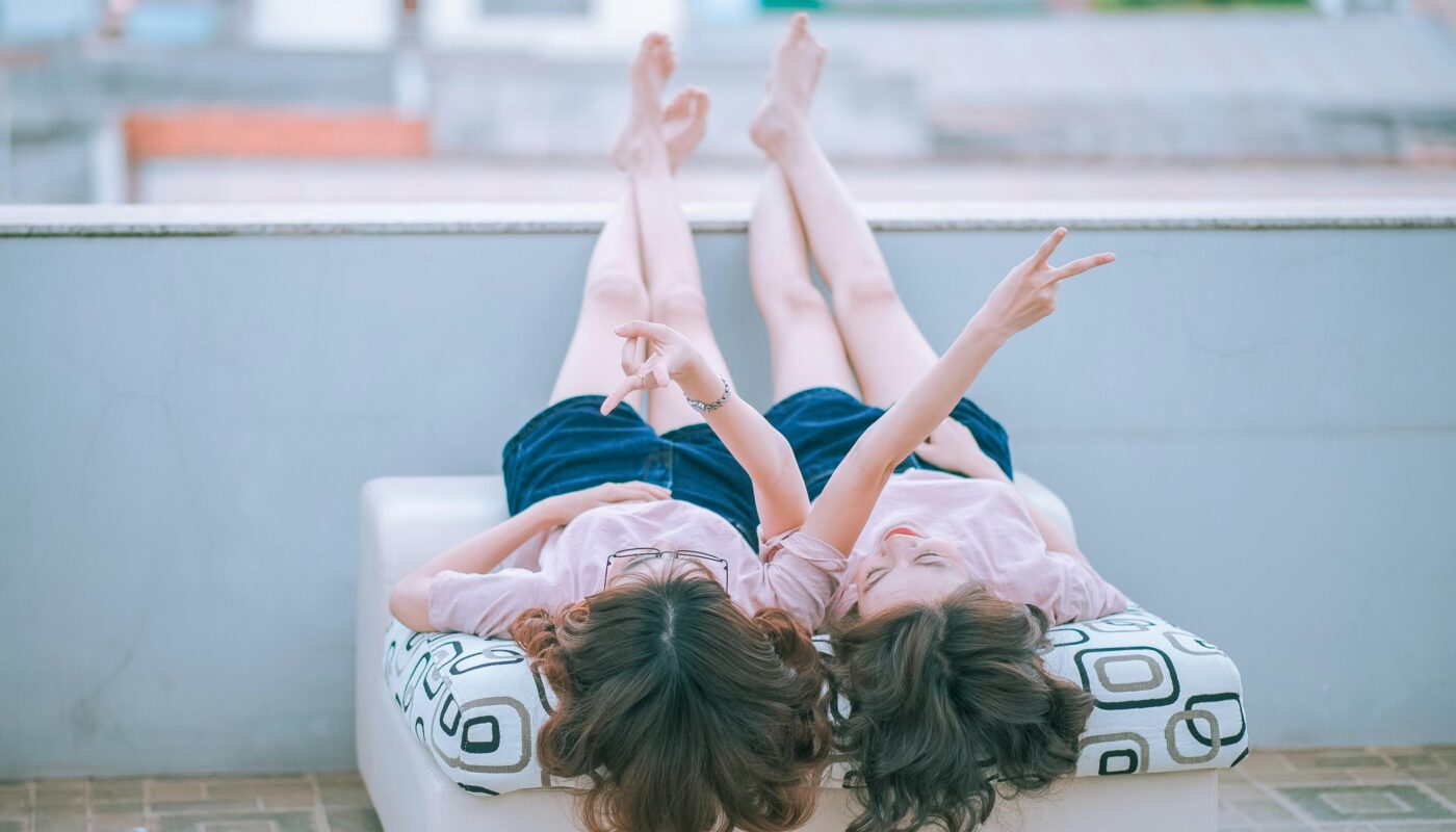 https://www.pexels.com/photo/two-women-lying-on-white-mattress-271645/