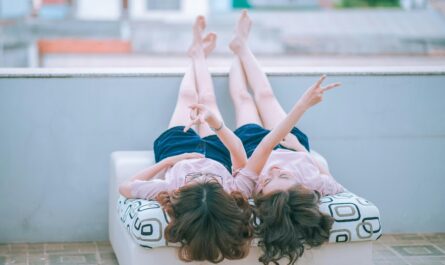 https://www.pexels.com/photo/two-women-lying-on-white-mattress-271645/