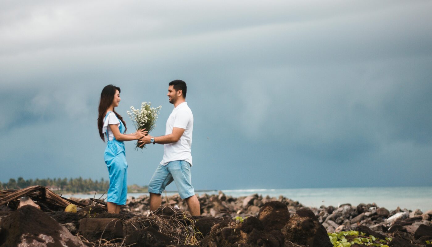 https://www.pexels.com/photo/photo-of-man-giving-flowers-to-woman-935824/