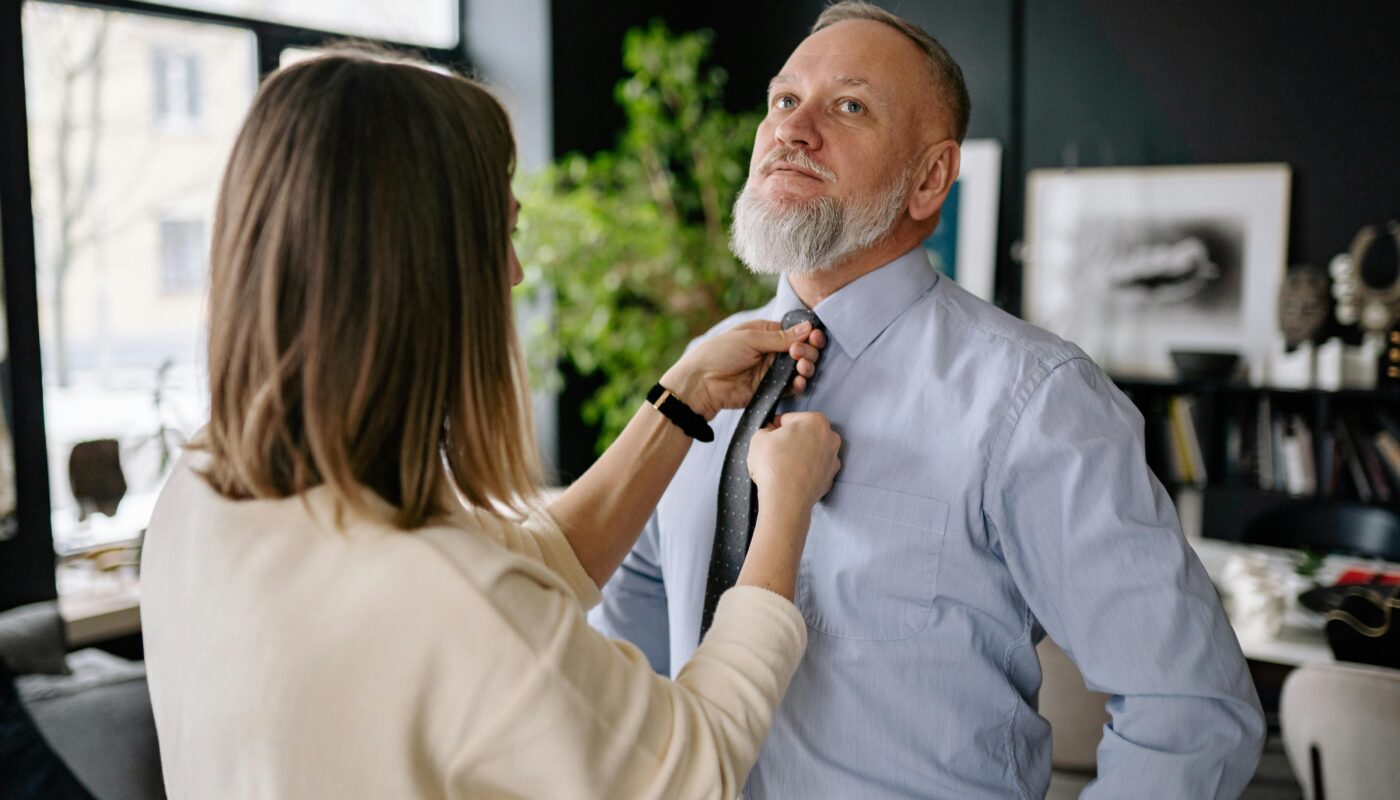 https://www.pexels.com/photo/woman-holding-man-tie-6816345/