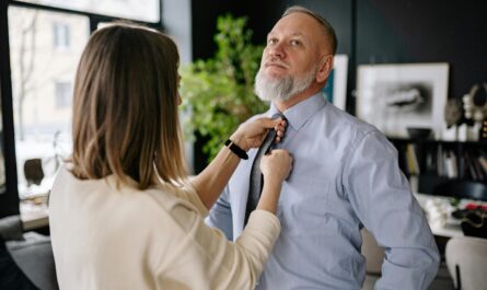 https://www.pexels.com/photo/woman-holding-man-tie-6816345/