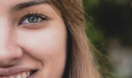 smiling woman with blonde hair in selective focus photography